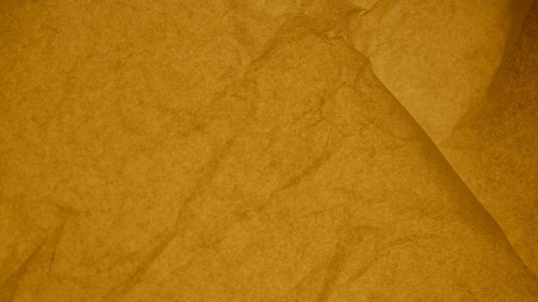 yellow parchment paper in close up photography