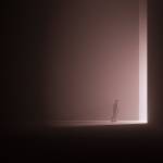 person in black shirt standing on white floor