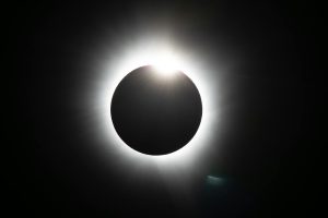 sunlight behind moon in eclipse